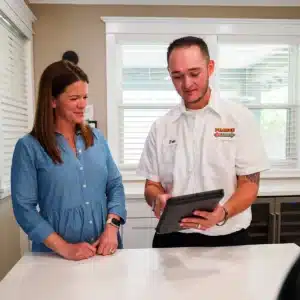 Pearce technician helping homeowner
