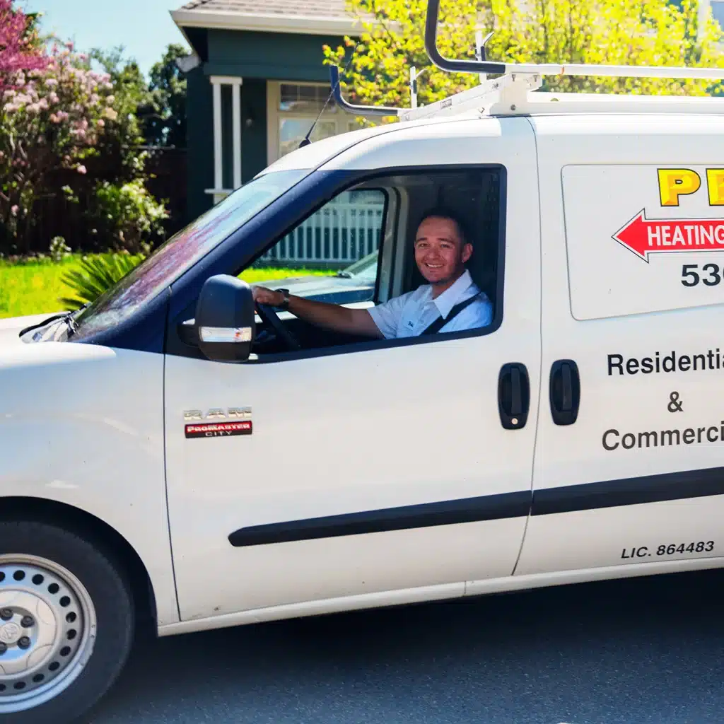 Pearce technician driving the Pearce van in a dixon, CA neighborhood.