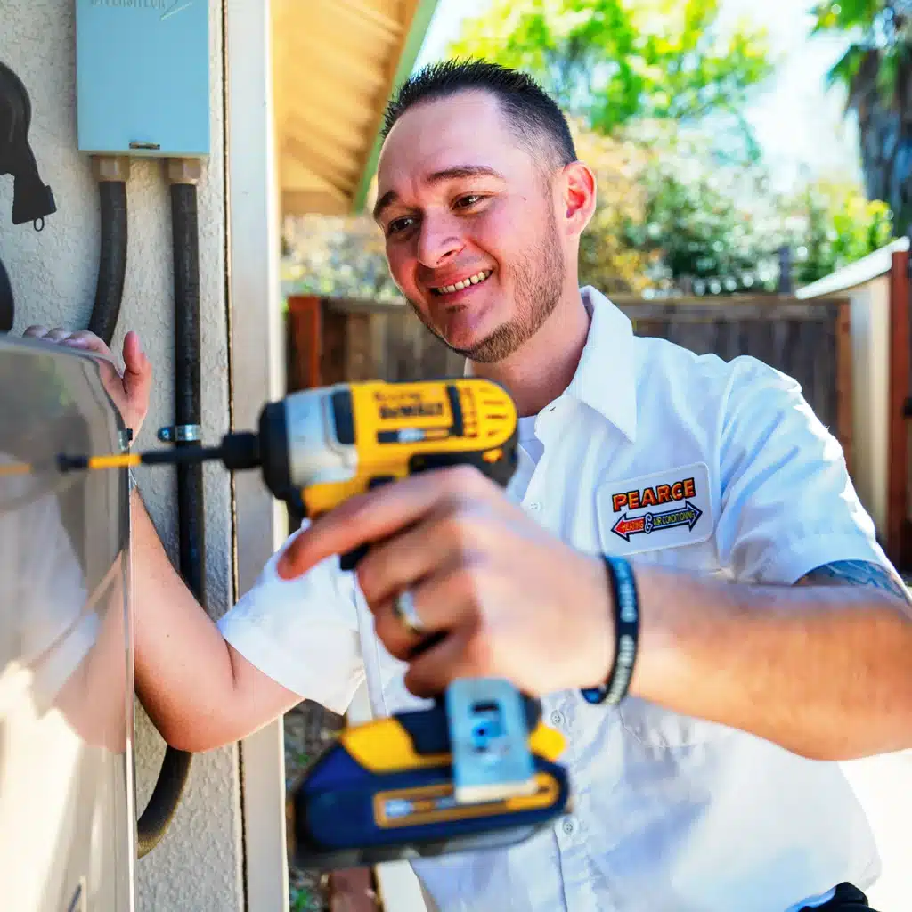 Pearce Technician repairing an HVAC unit in Winters, CA
